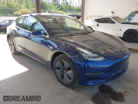 2018 Tesla Model 3 Long Range Battery z VIN 5YJ3E1EA6JF041970, wystawiony jako IAAI lot #42224514 z przebiegiem 79 744 mil mil oraz . Historia ofert i sprzedaży dostępna na DreamBid. Obrazek 1.