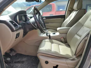 2014 Jeep Grand Cherokee Overland with VIN 1C4RJFCG4EC326325, listed as a Copart auction lot 49166645 with 128,261 mi miles and Salvage Title. Bid and sale history available at DreamBid. Image 7.