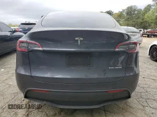 2024 Tesla Model Y Long Range z VIN 7SAYGDEE9RA293776, wystawiony jako Copart lot #51289225 z przebiegiem 12 990 mil mil oraz Szkoda całkowita • Salvage title. Historia ofert i sprzedaży dostępna na DreamBid. Obrazek 6.