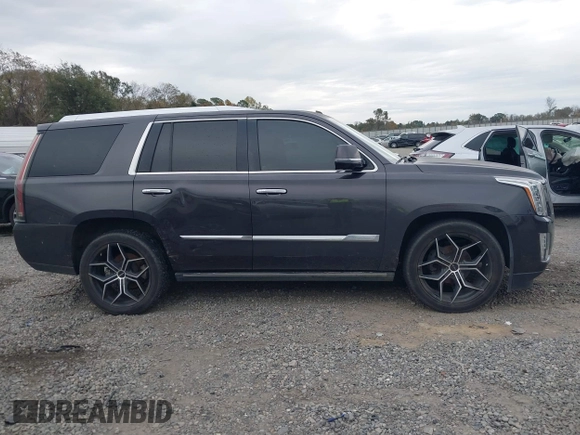 2016 Cadillac Escalade Platinum z VIN 1GYS4DKJ1GR363238, wystawiony jako IAAI lot #40974636 z przebiegiem 128 296 mil mil oraz . Historia ofert i sprzedaży dostępna na DreamBid. Obrazek 13.