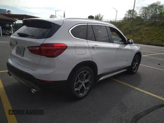 2016 BMW X1 xDrive28i with VIN WBXHT3C3XGP880243, listed as a Copart auction lot 48908425 with 56,100 mi miles and Salvage Title. Bid and sale history available at carsss.com. Image 4.