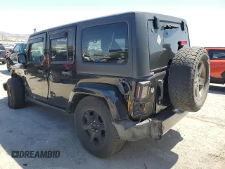 2015 Jeep Wrangler Unlimited Freedom with VIN 1C4HJWDG0FL598947, listed as a Copart auction lot 61794214 with 125,778 mi miles and Salvage title. Bid and sale history available at DreamBid. Image 2.