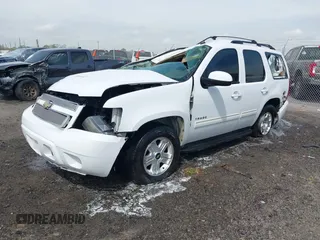 2011 Chevrolet Tahoe LS with VIN 1GNSCAE09BR352496, listed as a IAAI auction lot 41888764 with 234,311 mi miles and . Bid and sale history available at DreamBid. Image 2.