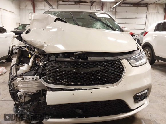 2021 Chrysler Pacifica Touring L with VIN 2C4RC1BG7MR531772, listed as a IAAI auction lot 41834392 with 156,123 mi miles and . Bid and sale history available at DreamBid. Image 6.