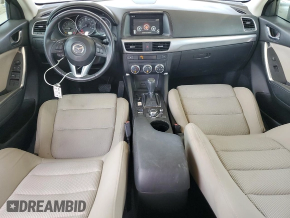 2016 Mazda CX-5 Touring with VIN JM3KE2CY9G0834048, listed as a Copart auction lot 54491535 with 116,328 mi miles and Salvage Title. Bid and sale history available at DreamBid. Image 8.