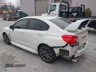 2015 Subaru WRX with VIN JF1VA1A67F9819707, listed as a IAAI auction lot 42021831 with 104,706 mi miles. Bid and sale history available at carsss.com. Image 3.