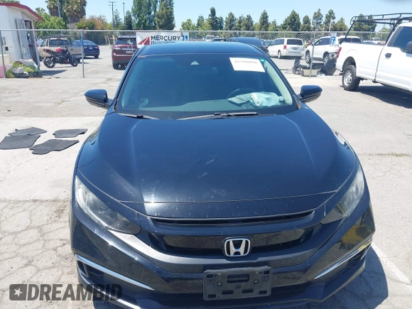 2020 Honda Civic LX with VIN 19XFC2F66LE213975, listed as a IAAI auction lot 42398098 with 69,902 mi miles and . Bid and sale history available at DreamBid. Image 12.