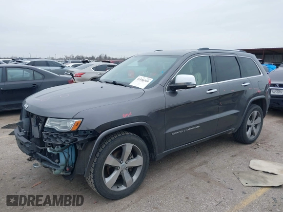2014 Jeep Grand Cherokee Overland with VIN 1C4RJECG5EC207211, listed as a IAAI auction lot 41586309 with 115,293 mi miles. Bid and sale history available at carsss.com. Image 18.