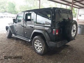 2023 Jeep Wrangler Willys with VIN 1C4HJXDG0PW617101, listed as a IAAI auction lot 42111687 with 56,415 mi miles and . Bid and sale history available at DreamBid. Image 3.