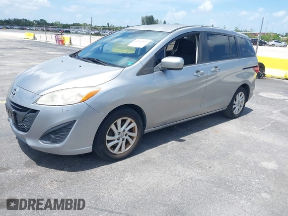 2012 Mazda 5 Sport with VIN JM1CW2BL8C0129591, listed as a IAAI auction lot 42513037 with 177,206 mi miles and . Bid and sale history available at DreamBid. Image 2.