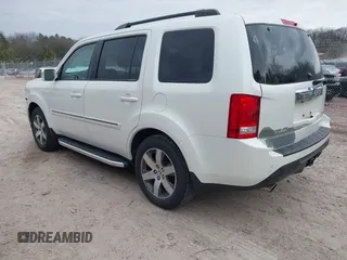 2014 Honda Pilot Touring with VIN 5FNYF4H91EB041614, listed as a IAAI auction lot 42050405 with 158,236 mi miles and . Bid and sale history available at DreamBid. Image 3.
