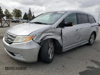 2012 Honda Odyssey Touring with VIN 5FNRL5H94CB051019, listed as a Copart auction lot 54754645 with 126,360 mi miles and Salvage title. Bid and sale history available at DreamBid. Image 1.