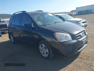 2009 Kia Rondo LX with VIN KNAFG529797268303, listed as a IAAI auction lot 42088100 with 140,458 mi miles. Bid and sale history available at carsss.com. Image 1.
