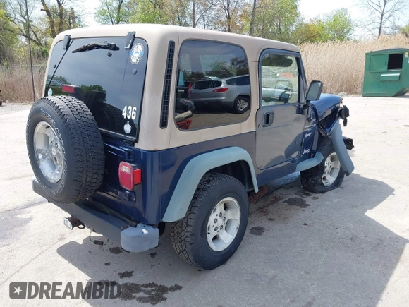 2000 Jeep Wrangler Sport with VIN 1J4FA49S5YP750123, listed as a IAAI auction lot 42060009 with Not Provided miles. Bid and sale history available at carsss.com. Image 4.