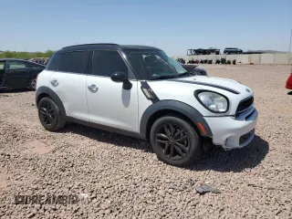 2016 MINI Countryman S with VIN WMWZC3C58GWT09694, listed as a Copart auction lot 57113235 with 126,082 mi miles and Salvage title. Bid and sale history available at DreamBid. Image 4.