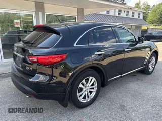 2014 Infiniti QX70 with VIN JN8CS1MW1EM411715, listed as a IAAI auction lot 42769793 with 180,472 mi miles and . Bid and sale history available at DreamBid. Image 4.