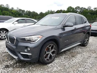 2018 BMW X1 sDrive28i z VIN WBXHU7C34J5L05496, wystawiony jako Copart lot #60229735 z przebiegiem 163 005 mil mil oraz Czysty tytuł • Clean title. Historia ofert i sprzedaży dostępna na DreamBid. Obrazek 1.
