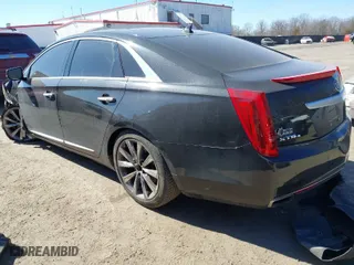 2013 Cadillac XTS Luxury with VIN 2G61R5S33D9184878, listed as a IAAI auction lot 41644213 with 113,293 mi miles. Bid and sale history available at carsss.com. Image 3.