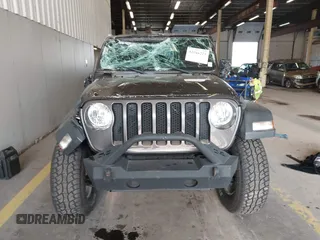 2020 Jeep Wrangler Willys z VIN 1C4GJXAG4LW237057, wystawiony jako IAAI lot #42044223 z przebiegiem 54 802 mil mil oraz . Historia ofert i sprzedaży dostępna na DreamBid. Obrazek 13.