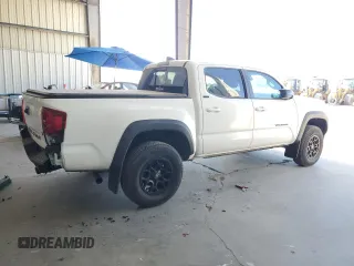 2023 Toyota Tacoma SR5 z VIN 3TMAZ5CN3PM219718, wystawiony jako Copart lot #55253845 z przebiegiem 18 879 mil mil oraz Szkody całkowita. Historia ofert i sprzedaży dostępna na DreamBid. Obrazek 3.