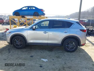 2020 Mazda CX-5 Touring with VIN JM3KFACM8L0727393, listed as a IAAI auction lot 41492627 with 91,521 mi miles. Bid and sale history available at carsss.com. Image 14.