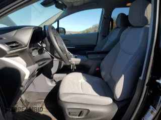 2024 Toyota Sienna LE with VIN 5TDKRKEC3RS210941, listed as a Copart auction lot 77763414 with 9,863 mi miles and Salvage Title. Bid and sale history available at carsss.com. Image 7.