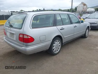 1999 Mercedes-Benz E-Class with VIN WDBJH65F5XA721205, listed as a IAAI auction lot 42068204 with 183,421 mi miles. Bid and sale history available at carsss.com. Image 4.