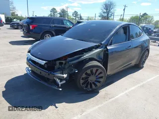 2024 Tesla Model Y Performance with VIN 7SAYGDEF1RA329825, listed as a IAAI auction lot 41762602 with 3,923 mi miles and . Bid and sale history available at DreamBid. Image 21.