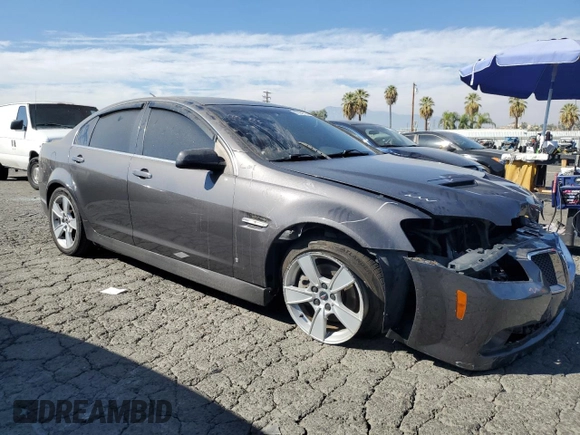 2009 Pontiac G8 GT with VIN 6G2EC57Y19L215718, listed as a Copart auction lot 77231714 with 57,515 mi miles and Salvage Title. Bid and sale history available at carsss.com. Image 4.