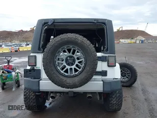 2015 Jeep Wrangler Unlimited Sahara with VIN 1C4BJWEG5FL518191, listed as a IAAI auction lot 41914581 with 107,433 mi miles. Bid and sale history available at carsss.com. Image 16.