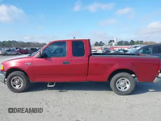 2000 Ford F-150 XL with VIN 1FTZX1729YNC32076, listed as a IAAI auction lot 41523364 with 216,726 mi miles. Bid and sale history available at carsss.com. Image 14.