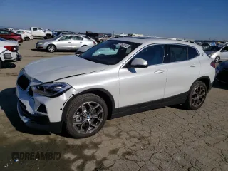 2023 BMW X2 sDrive28i with VIN WBXYH9C01P5V56801, listed as a Copart auction lot 37868343 with 2,516 mi miles. Bid and sale history available at carsss.com. Image 1.