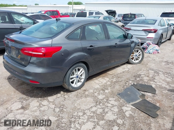 2018 Ford Focus SE with VIN 1FADP3F20JL312395, listed as a IAAI auction lot 42110335 with 110,720 mi miles and . Bid and sale history available at DreamBid. Image 4.