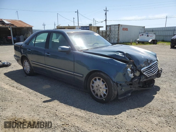 2000 Mercedes-Benz E-Class with VIN WDBJF65J1YB151080, listed as a Copart auction lot 54421955 with 392,612 mi miles and Salvage Title. Bid and sale history available at carsss.com. Image 4.