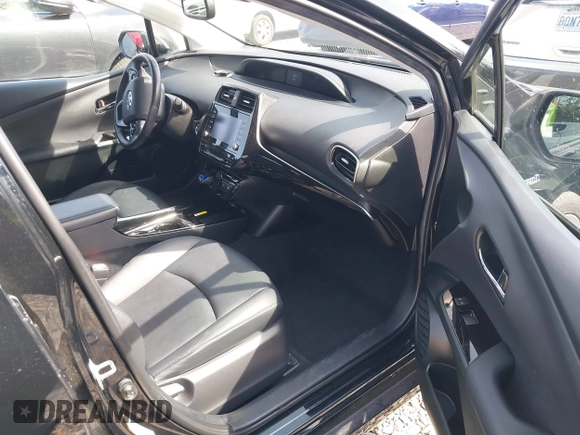 2021 Toyota Prius L Eco with VIN JTDKAMFU8M3136565, listed as a IAAI auction lot 42161896 with 39,634 mi miles and . Bid and sale history available at DreamBid. Image 5.