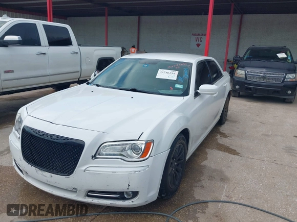 2013 Chrysler 300 with VIN 2C3CCAAG9DH588198, listed as a IAAI auction lot 42556294 with 171,765 mi miles and . Bid and sale history available at DreamBid. Image 2.