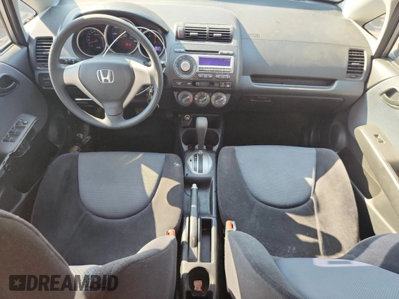 2007 Honda Fit with VIN JHMGD38407S066833, listed as a Copart auction lot 61713125 with 62,917 mi miles and Salvage title. Bid and sale history available at DreamBid. Image 8.