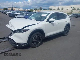 2023 Mazda CX-5 2.5 S Premium Plus Package with VIN JM3KFBEM4P0112803, listed as a IAAI auction lot 41588872 with 25,087 mi miles. Bid and sale history available at carsss.com. Image 2.