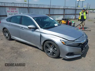 2021 Honda Accord Touring with VIN 1HGCV2F99MA014738, listed as a IAAI auction lot 42392129 with 25,802 mi miles and . Bid and sale history available at DreamBid. Image 1.