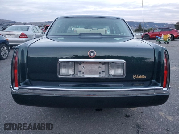 1995 Cadillac DeVille z VIN 1G6KD52B0SU252838, wystawiony jako Copart lot #87642595 z przebiegiem 72 847 mil mil oraz Szkoda całkowita • Salvage title. Historia ofert i sprzedaży dostępna na DreamBid. Obrazek 6.