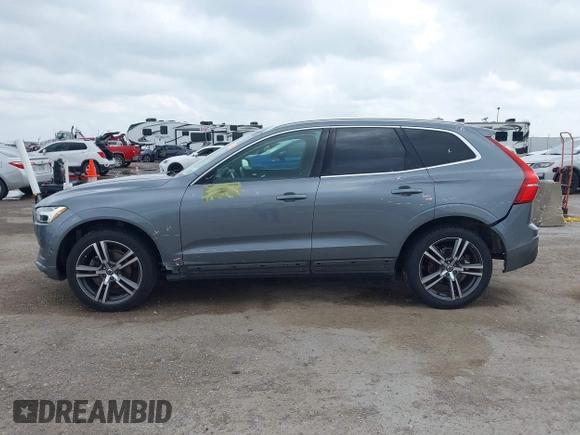 2018 Volvo XC60 Momentum z VIN LYV102RK1JB079168, wystawiony jako IAAI lot #42115403 z przebiegiem 58 377 mil mil oraz . Historia ofert i sprzedaży dostępna na DreamBid. Obrazek 14.