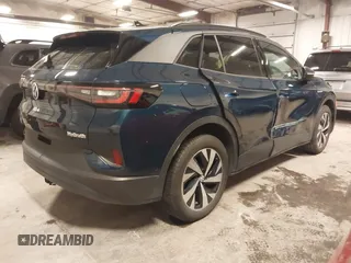 2023 Volkswagen ID.4 Pro z VIN 1V2DNPE84PC038042, wystawiony jako IAAI lot #41446269 z przebiegiem 12 878 mil mil oraz . Historia ofert i sprzedaży dostępna na DreamBid. Obrazek 4.