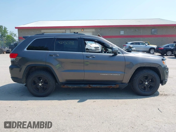 2015 Jeep Grand Cherokee Altitude with VIN 1C4RJFAG5FC710943, listed as a IAAI auction lot 42430708 with 163,776 mi miles and . Bid and sale history available at DreamBid. Image 13.