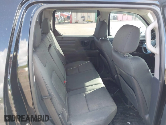 2013 Honda Ridgeline Sport with VIN 5FPYK1F70DB011814, listed as a IAAI auction lot 41689579 with 136,251 mi miles and . Bid and sale history available at DreamBid. Image 8.