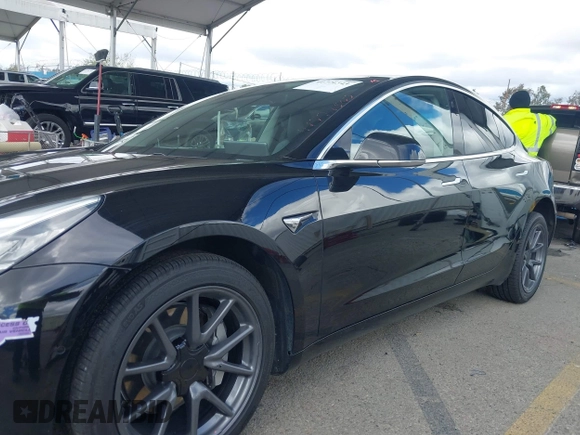 2019 Tesla Model 3 Mid Range with VIN 5YJ3E1EA3KF325056, listed as a IAAI auction lot 41771543 with 183,157 mi miles and . Bid and sale history available at carsss.com. Image 14.