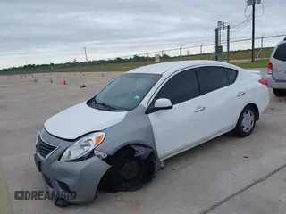 2014 Nissan Versa SV with VIN 3N1CN7AP9EL809772, listed as a IAAI auction lot 42199651 with 163,102 mi miles. Bid and sale history available at carsss.com. Image 2.