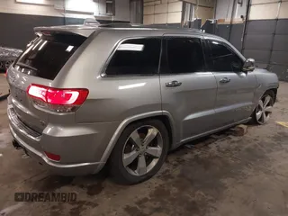 2015 Jeep Grand Cherokee Overland with VIN 1C4RJFCG1FC215426, listed as a IAAI auction lot 41689821 with 128,563 mi miles. Bid and sale history available at carsss.com. Image 4.