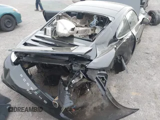 2014 Porsche 911 Carrera with VIN WP0AA2A92ES106536, listed as a IAAI auction lot 42048411 with 108,216 mi miles and . Bid and sale history available at DreamBid. Image 6.