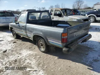 1990 Toyota Pickup z VIN JT4RN81R3L0056975, wystawiony jako Copart lot #88053235 z przebiegiem 144 149 mil mil oraz Tytuł czysty. Historia ofert i sprzedaży dostępna na DreamBid. Obrazek 2.