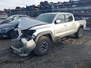 2021 Toyota Tacoma 4WD SR5 with VIN 5TFDZ5BN2MX063823, listed as a IAAI auction lot 41447098 with 52,538 mi miles. Bid and sale history available at carsss.com. Image 2.